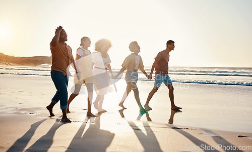 Image of Happy, summer and friends holding hands at sunset beach for fun and travel with care. Diversity, men and women group outdoor for walk on sand with love, support and happiness on vacation or holiday