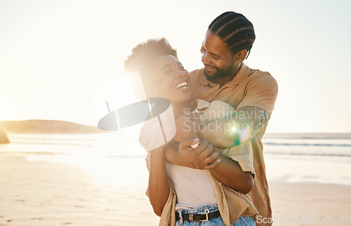 Image of Beach, sunset and happy black couple hug, love and enjoy time together on Nigeria vacation, travel or romantic date. Marriage honeymoon, lens flare and relax African people embrace on anniversary