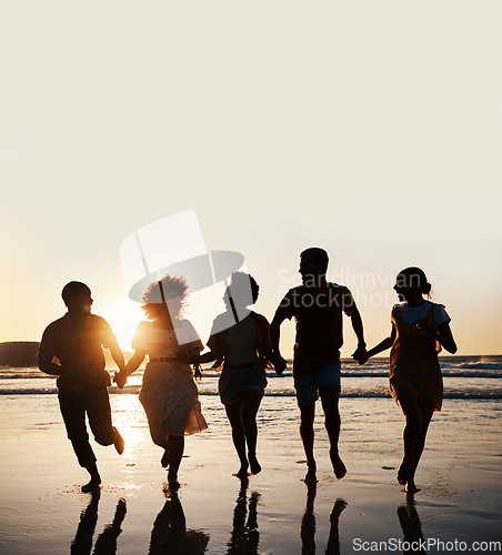 Image of Silhouette, summer and friends holding hands at sunset beach for fun and travel. Banner space, men and women group running outdoor in water with love, support and happiness on vacation or holiday