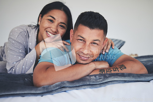 Image of Portrait, bed or happy couple in home with love, care or support while bonding to relax in home together. Morning, man or woman lying in bedroom with smile, peace or loyalty in marriage commitment