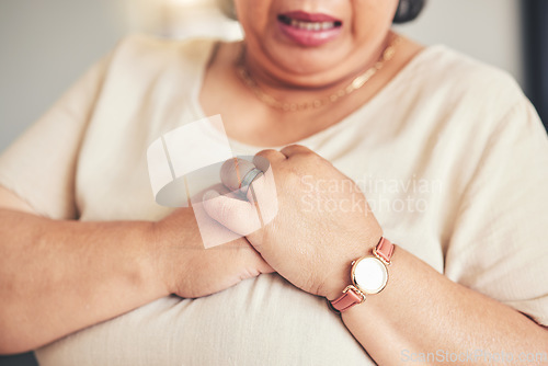 Image of Heart attack, healthcare and closeup of a senior woman with chest pain, injury or accident. Medical emergency, breathe and zoom of elderly female hands with lung sickness or infection at her home.