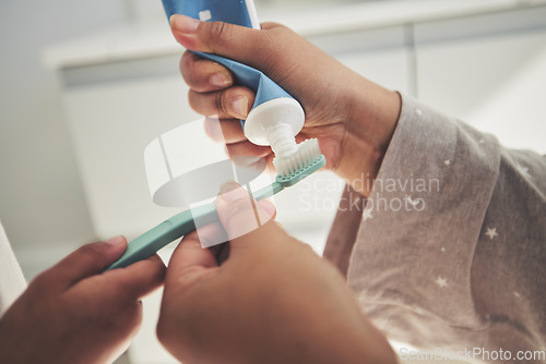 Image of Hands, brushing teeth and a parent teaching a child about dental care with a family in a bathroom together closeup. Toothbrush, toothpaste and dentist product with people in a home for oral hygiene