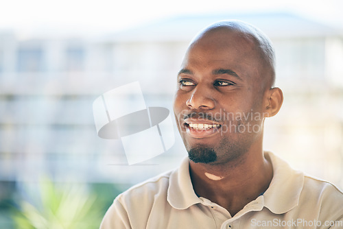 Image of Smile, thinking and businessman in office with confidence, brainstorming and positive attitude. Young, dreaming and face headshot of professional African male designer standing in a modern workplace.