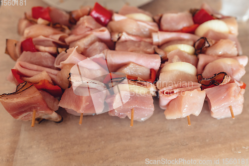 Image of raw meat on skewers ready for grill