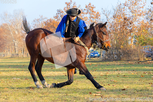 Image of Hungarian csikos horseman in traditional folk costume