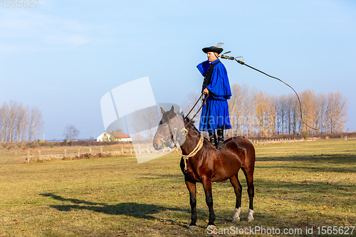 Image of Hungarian csikos horseman in traditional folk costume