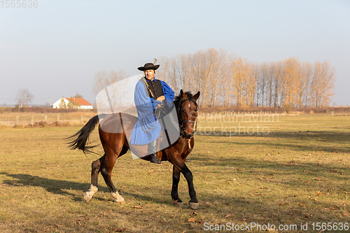 Image of Hungarian csikos horseman in traditional folk costume