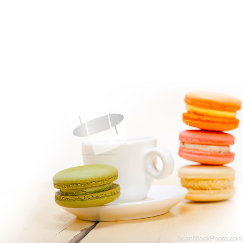 Image of colorful macaroons with espresso coffee