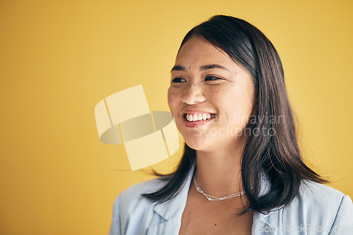 Image of Thinking, smile and Asian woman in creative business studio isolated on a yellow background mockup space. Vision, happy and designer, entrepreneur and employee worker planning startup idea in office