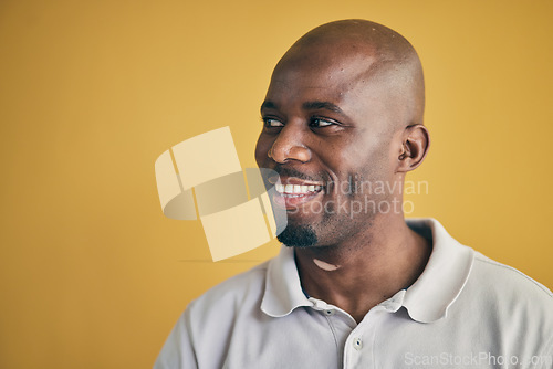 Image of Thinking, happy and black man in creative business studio isolated on a yellow background mockup space. Vision, smile and African designer, entrepreneur and employee worker planning startup idea.