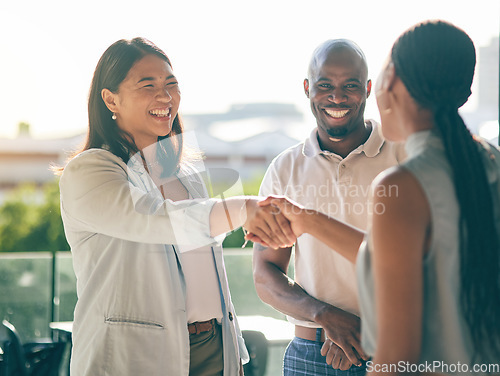 Image of Business people, handshake and happy in collaboration, deal or agreement in city. Shaking hands, smile and group in b2b partnership, integration and success in negotiation for startup acquisition