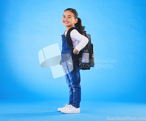 Image of School, backpack and portrait of child on blue background ready for class, learning and education. Student, happy and young girl with bag excited for lesson, academy and kindergarten in studio