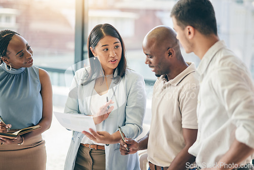 Image of Meeting, business people with woman boss and paperwork for training, motivation and collaboration. Teamwork, men and women in office with documents, feedback and brainstorming at workshop with mentor