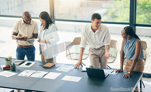 Image of Meeting, men and women with laptop, paperwork and workshop for motivation, discussion and collaboration. Teamwork, business people in office together with computer, b2b documents and brainstorming.