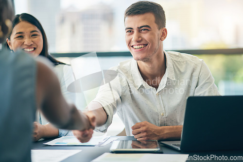 Image of Business people, shaking hands and happy in interview, hiring or onboarding. Handshake, deal and group in b2b collaboration, partnership and success in negotiation for startup acquisition agreement