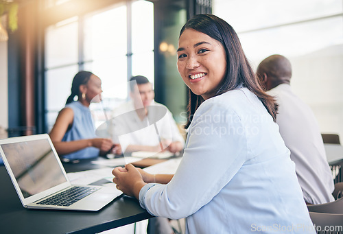 Image of Portrait, business and woman in a meeting, laptop and brainstorming with ideas, cooperation and feedback. Face, Asian person or corporate professional with teamwork, planning for a project or support