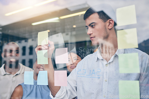 Image of Window, collaboration and sticky note, brainstorming and man is writing, project management and strategy. Ideas, planning and business people with moodboard, workshop and goals with productivity