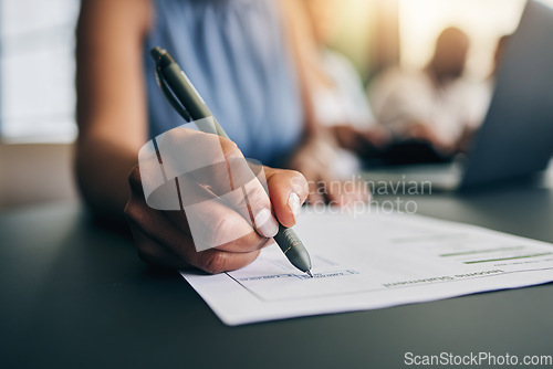 Image of Closeup, hand and a person with a document for accounting, finance paperwork or business. Desk, office and an accountant or employee writing on a report or agreement for a salary or work income