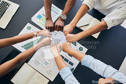 Image of Fist circle, business people and documents with group, teamwork and planning at startup, office or top view. Team building, hands and synergy with link, connection or paperwork for start in workplace