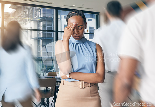 Image of Busy office, people and a black woman with a headache, workplace stress or burnout from chaos. Tired, corporate and an African employee with pain, anxiety or fatigue from a fast company and workers