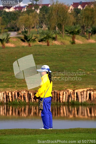 Image of China golf caddie waiting