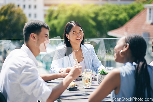 Image of Conversation, lunch and friends eating on a rooftop of a building on break together at the office. Happy, discussion and business people talking, bonding and enjoying a meal for brunch on the balcony