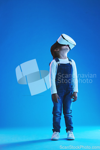 Image of Glasses, virtual reality and metaverse with girl, future and digital transformation on a blue studio background. Kid, mockup space and model with vr headset for video games, futuristic and innovation