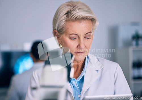 Image of Science, tablet and medical with woman in laboratory for planning, research and pharmacy. Medicine, healthcare and digital report with mature scientist reading online for email, data and result