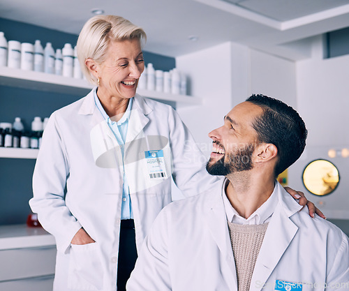 Image of Research, medical and staff with conversation, laboratory and communication with a smile, science and collaboration. Teamwork, happy researcher and scientist in a lab, innovation and biotechnology