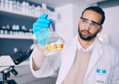 Image of Science laboratory, chemical analysis and man check medicine progress, lab research or medical development. Chemistry process, beaker experiment and male scientist investigation of liquid solution