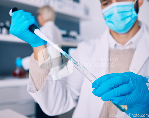 Image of Closeup, vial and hands of a scientist for research of liquid for a chemistry test in a lab. Safety, medicine and a pharmacy employee with gear for biotechnology or a technician studying a chemical