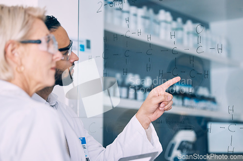 Image of Research, team and writing glass formula, planning particles and conversation to develop theory, experiment and brainstorming equation. Science, staff and workers in a lab, study and data analyzing