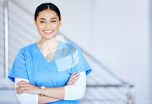 Image of Portrait, nurse and woman with arms crossed, smile and career with healthcare, surgeon and expert in a hospital. Person, medical professional and physician in a clinic, wellness and life insurance