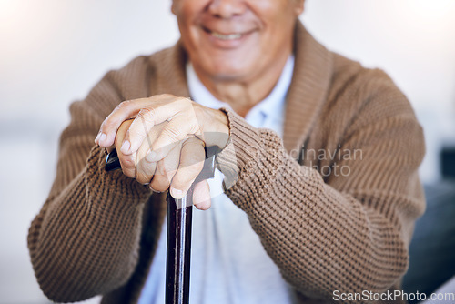 Image of Closeup, hands or walking stick of senior person with a disability in nursing home for mobility support, help or balance. Elderly patient, fingers or cane in house living room or arthritis healthcare
