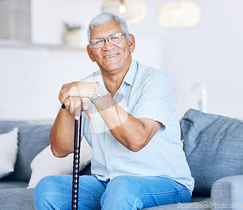 Image of Portrait, home and old man with a walking stick, relax and support with retirement, peace or calm on a couch. Senior person in a living room, elder or pensioner on a sofa, cane or health with a smile