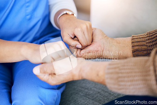 Image of Closeup, nurse and patient holding hands, help and consultation with healthcare, home and support. Zoom, caregiver or pensioner with sympathy, praying and advice with results, hope and rehabilitation