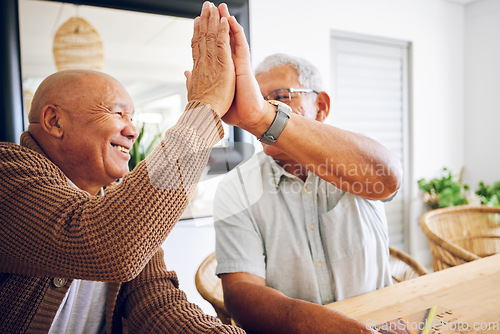 Image of Senior game, happy and men with a high five for success, motivation or a win. Smile, together and elderly people with a hand gesture for support, goal or trust in a retirement home with solidarity