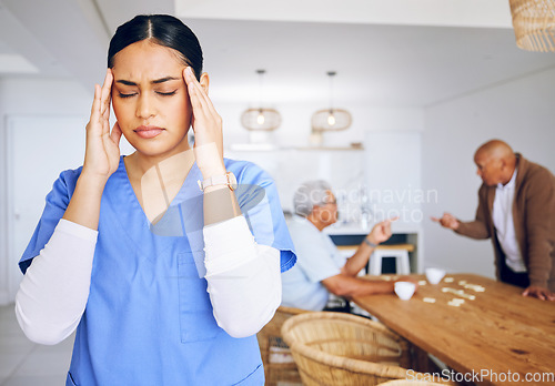 Image of Caregiver, nurse and headache from stress in working with elderly, nursing home or woman with burnout, migraine ir fatigue. Tired, frustrated or person in pain with senior people in conflict or fight