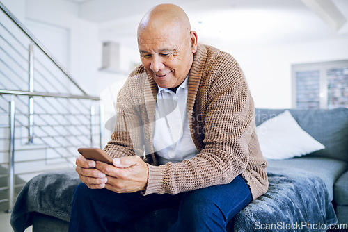 Image of Old man on bed with phone, smile and typing message, communication and technology in retirement. Social media, internet and cellphone, happy senior person in bedroom reading email or chat online.