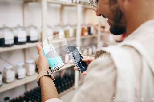 Image of Customer, shopping and phone for reading grocery product, healthy food and can tin information in store. Research, happy man and nutritionist customer on technology for supermarket choice or decision