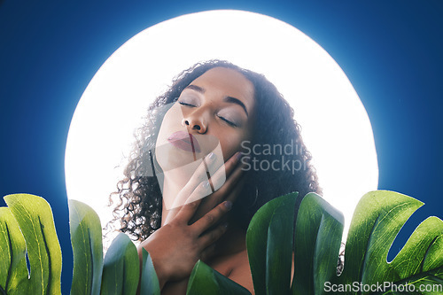 Image of Beauty, lighting and face of woman with leaf for wellness, natural cosmetics and skincare in studio. Neon circle, creative aesthetic and person for makeup, glamour and facial care on blue background