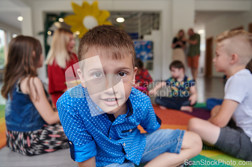 Image of Portrait photo of a smiling boy in a preschool institution having fun