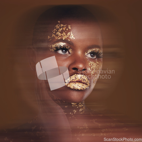 Image of Gold beauty, makeup and black woman with blur in studio with glitter cosmetics and sparkle art. Brown background, African female model and shine from paint and skin glow with golden luxury treatment