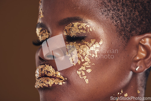 Image of Gold, beauty and black woman with makeup for aesthetic isolated in a studio brown background eyes closed. Creative, luxury and face of African person with cosmetic glamour or design for skincare