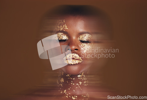 Image of Blurred beauty, black woman with gold makeup and brown background, glitter paint or cosmetics. Shine, glow and art, face of African model in studio for fashion and aesthetic motion in luxury skincare