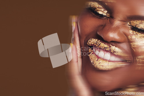 Image of Art, portrait of black woman with gold makeup and blurred background, glitter paint and cosmetics. Shine, glow and African model in studio for beauty, fashion and aesthetic freedom in luxury skincare