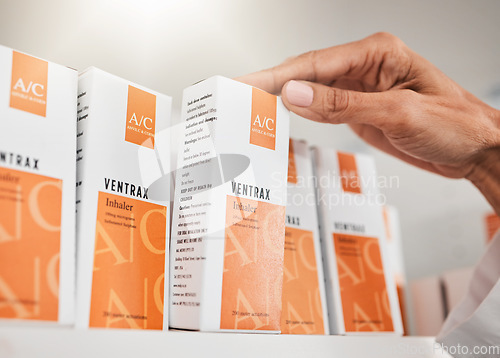 Image of Person, pharmacist and hands with box for inventory inspection or checking stock on shelf at pharmacy. Closeup of medical or healthcare worker with pills, medication or pharmaceutical at drugstore