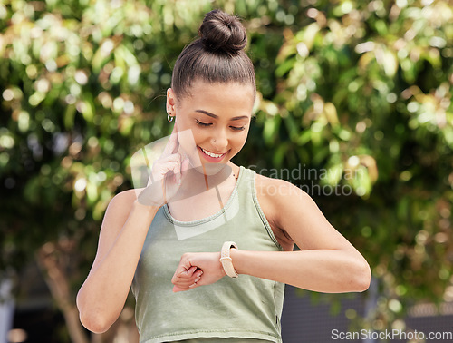 Image of Smart watch, pulse and woman outdoor in fitness, exercise and workout in nature. Heart rate, clock and happy athlete check in cardio, training progress and sports in healthy body, wellness and time