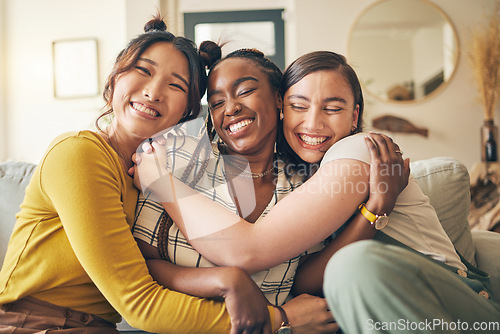 Image of Portrait of a group of women, friends hug on sofa with smile and bonding in living room together in embrace. Hug, love and friendship, girls on couch with diversity, pride and people in home with fun