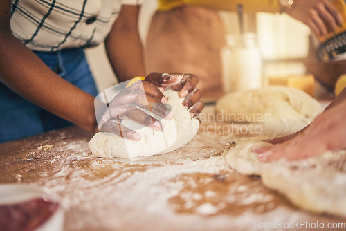 Image of Bakery, hands and baking by people or chef on a kitchen table cooking bread, pizza or pastry with dough. Culinary, counter and person preparing food at a restaurant with ingredient or recipe